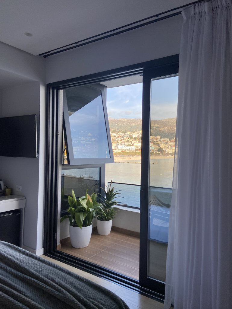 Rea Boutique Hotel Window View - Visit Himara - Josei Life Travel UGC Content Creation by Xhesika