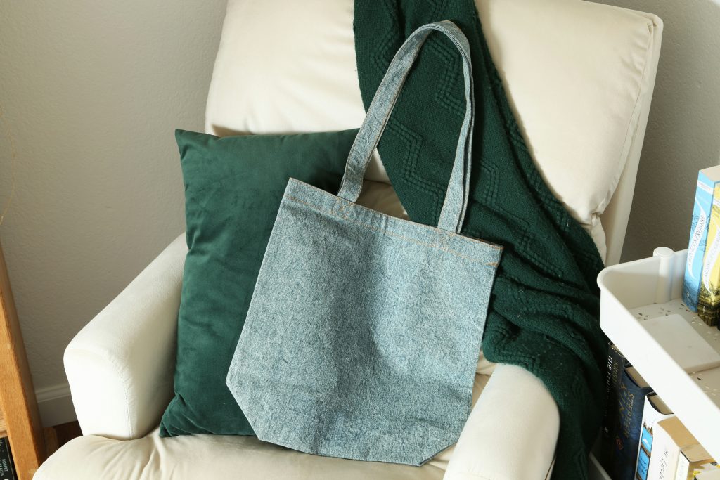 Dropshipping as a Side Hustle in 2025: What Still Works and What’s Dead - Josei Life - jeans tote bag ona white couch