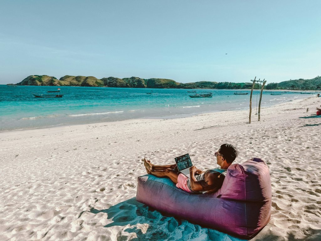 Top Sites to Find Fully Remote Jobs in 2025 - Josei Life - working at the beach
